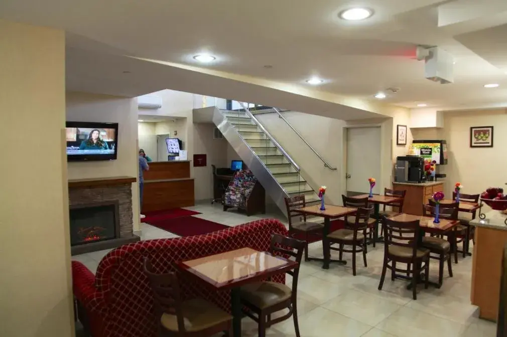 Room with satellite TV at Corona Hotel